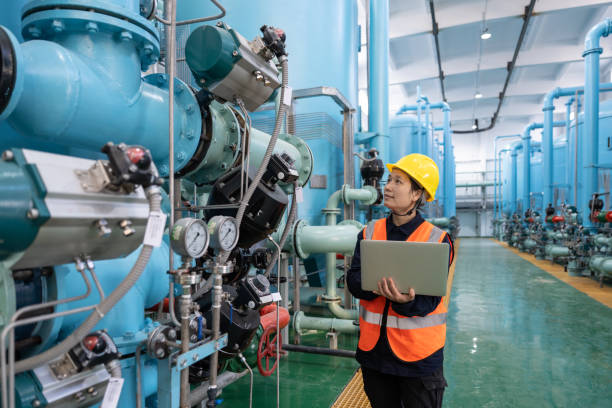 Vendor Management System 4 a female engineer works in a chemical plant using a laptop computer Vendor Management System Vatsin Technology Solutions