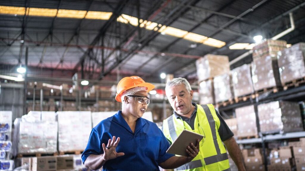 web size crop JPG mfg coworkers on a meeting at warehouse Blog Vatsin Technology Solutions